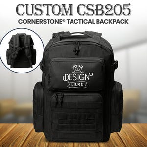 May include: Black Cornerstone Tactical Backpack with multiple compartments and MOLLE webbing. Features the text "CUSTOM CSB205" and "CORNERSTONE TACTICAL BACKPACK". Includes a smaller inset image of the backpack's back. The front pocket has the text "YOUR DESIGN HERE".