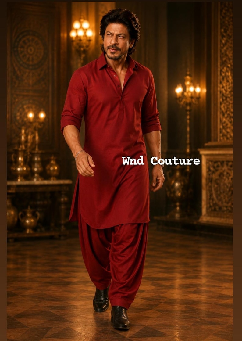 May include: A person wearing a maroon kurta and salwar suit. The outfit features a collared, button-down kurta with three-quarter sleeves and matching salwar pants. The text "Wnd Couture" is visible on the right side of the image.