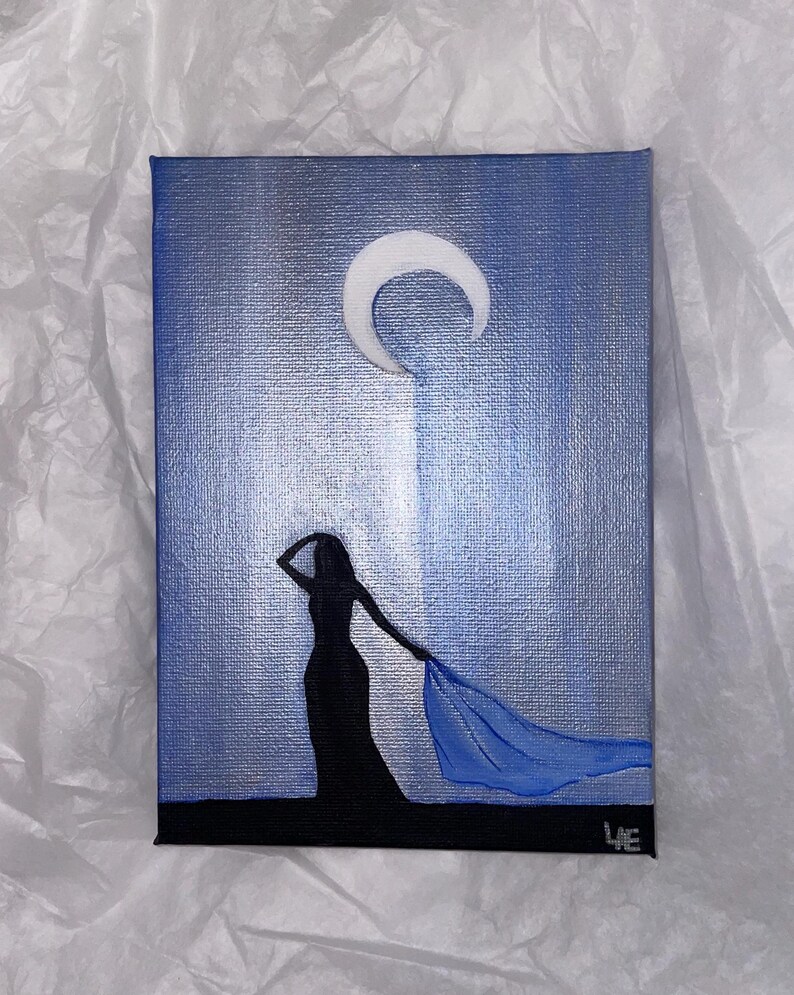 May include: A painting of a woman in a long dress with a flowing blue scarf, standing in front of a crescent moon against a blue and silver background.