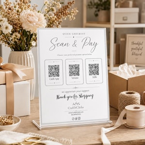 May include: A rectangular clear acrylic sign with a white background featuring the text Quick Checkout Scan & Pay, three QR codes for Cash App, Venmo, and Zelle, the text Thank you for Shopping, and the brand name CraftNClicks with social media icons.