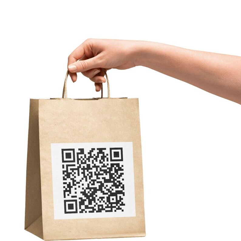 May include: A brown paper bag with a white square containing a black and white QR code. The bag has two brown handles.