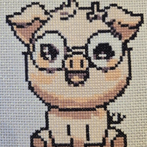 Patrón de punto de cruz de un lindo cerdo de dibujos animados