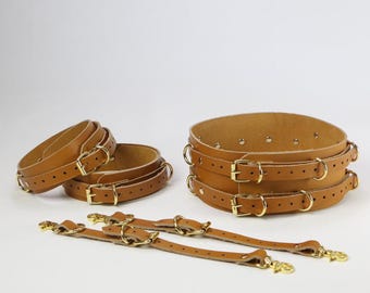 Conjunto de cinturón y puños para muslos de cuero genuino