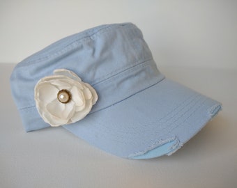 Light blue distressed army hat with distressed creamy white flower and pearl accents