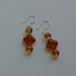 Sterling silver dangle earrings with golden amber glass vintage beads