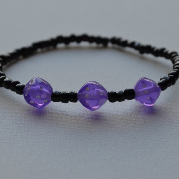 Bunco bracelet, black glass seed beads with 3 purple dice, stretch bracelet