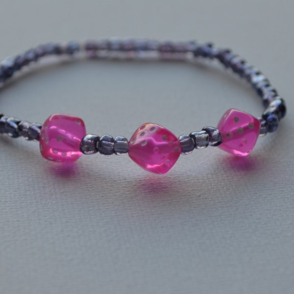 Bunco bracelet, purple glass seed beads with 3 pink dice, stretch bracelet