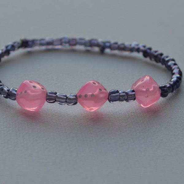 Bunco bracelet, purple glass seed beads with 3 light pink dice, stretch bracelet