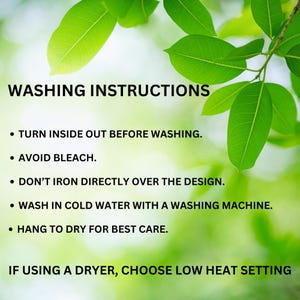 May include: Image with green leaves and text that reads "WASHING INSTRUCTIONS". Instructions include turning inside out before washing, avoiding bleach, not ironing directly on the design, washing in cold water, and hanging to dry.