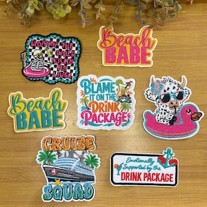 May include: A collection of embroidered patches with beach and cruise themes. Designs include a skeleton on a float, a cow in sunglasses, a cruise ship, and phrases like "Beach Babe" and "Drink Package."