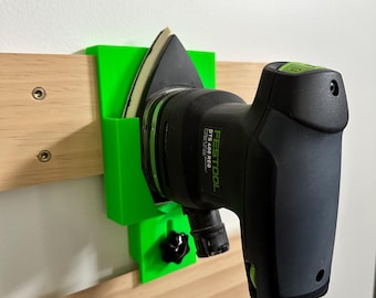 Soporte para lijadora Festool DTS 400: montaje en pared con bloqueo de grapa francesa