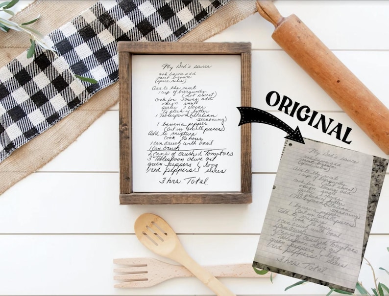 May include: A framed handwritten recipe for "My Dad's Sauce" on a white background. The recipe includes ingredients like ground meat, banana peppers, crushed tomatoes, and green peppers. The recipe is framed in a rustic wooden frame.