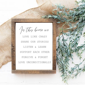 In This Home We... houten bord