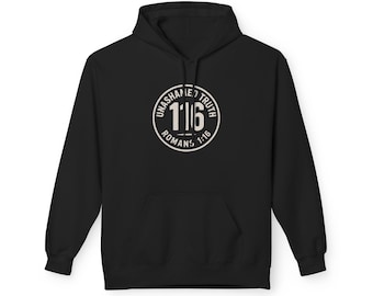 May include: Black hooded sweatshirt with a front pocket and a white circular graphic. The graphic reads "UNASHAMED TRUTH 1:16 ROMANS 1:16" in a vintage style. The sweatshirt is made of a soft material.