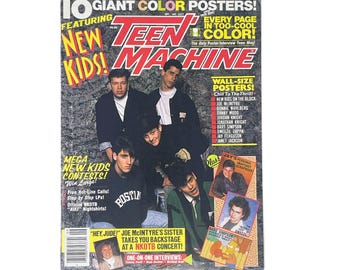 May include: A vintage Teen Machine magazine issue featuring the New Kids on the Block on the cover. The cover displays bold red and yellow text, multiple photographs of the band members, and promotional headlines about posters and contests.