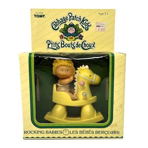 1983 Vintage Cabbage Patch Kids ROCKING BABIES. Blond Baby Girl. Factory Sealed Box. TOMY No. 2596 Wind-Up Toys. Bilingual French / English.