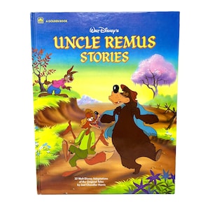 May include: A hardcover book titled Walt Disney's Uncle Remus Stories, A Golden Book. The cover features a colorful illustration of a rabbit in a pink shirt, a fox in a green vest, and a large brown bear in a blue shirt on a dirt path.