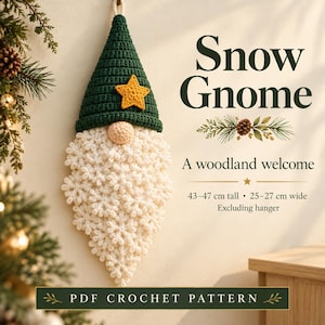 May include: A crochet wall hanging of a gnome with a dark green pointed hat, a yellow star, and a textured white beard. Text reads: Snow Gnome, A woodland welcome, 43-47 cm tall, 25-27 cm wide, Excluding hanger, PDF CROCHET PATTERN.