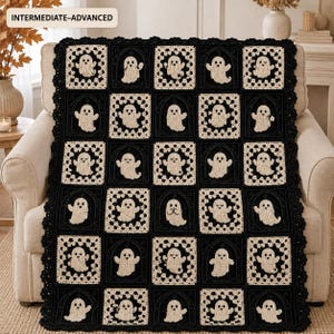 May include: A crochet blanket featuring a grid of alternating black and cream-colored squares. Each square displays a ghost motif. The blanket has a scalloped black border and includes the text INTERMEDIATE-ADVANCED in the top left corner.