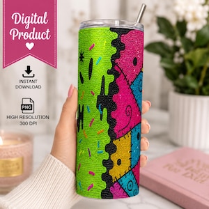 May include: A cylindrical tumbler featuring a vibrant rhinestone design with a split pattern. One side is bright lime green with small colorful sprinkles, while the other side displays a patchwork of pink, blue, and yellow fabric-like segments.
