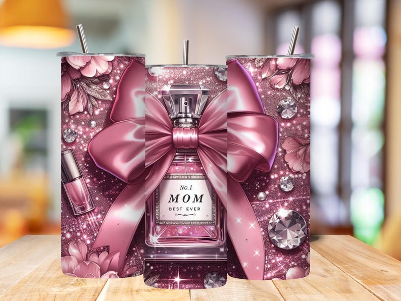 May include: A pink tumbler with a floral and glitter design, featuring a perfume bottle with a pink bow and the text "No. 1 MOM BEST EVER." Includes a nail polish bottle and diamond accents.