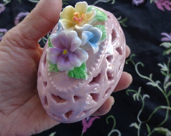 Ceramic Iridescent Pierced Egg Container.  Pink with applied porcelain flowers