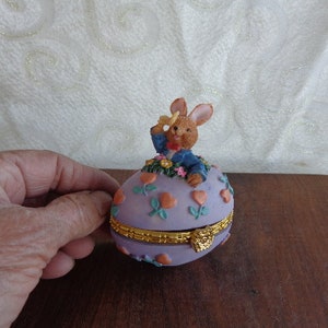EASTER BUNNY TRINKET Box - 3 1/4&quot;H x 3&quot;L x 2&quot;W - Resin Easter Bunny on Top a Gold Hinged Violet Decorated Egg - Not for Childen