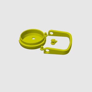 May include: A disassembled yellow plastic component set, featuring a circular base with a central hole, a U-shaped handle, and a small, separate piece. The parts are arranged against a light gray background.