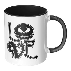 May include: White ceramic mug with a black interior and handle. The word "LOVE" is printed on the front in a stylized font, with the "O" replaced by a Jack Skellington face from The Nightmare Before Christmas.