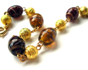Handmade Gold Stardust Bracelet with Gold Red and Amber Glass Swirl Beads
