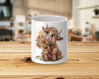 May include: White ceramic mug with a cartoon illustration of a brown and white cow holding a bouquet of yellow sunflowers. The cow is smiling and has big eyes.