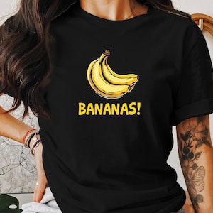 面白いバナナグラフィックシャツ、かわいいフルーツデザインTシャツ、ユーモラスなバナナTシャツ、黄色いバナナスウェットシャツ、スタイリッシュなフルーツプリントトップ