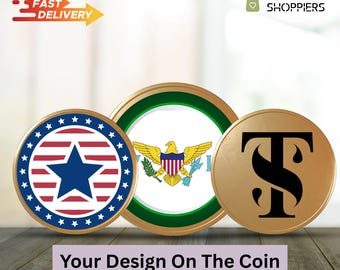 May include: Three gold-colored coins with different designs. The first coin features a red, white, and blue American flag with a blue star in the center. The second coin features the flag of the US Virgin Islands. The third coin features a black stylized letter 'T' with a stylized 'S' inside the 'T'. The text 'Your Design On The Coin' is below the coins.