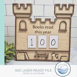 May include: Wooden castle-shaped book counter with the text "Books read this year" and the number "100" displayed. Includes the name "Jenny" and a dragon illustration. The design is laser-ready.