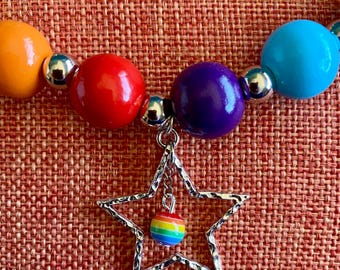 Chunky Wooden Rainbow and Silver Beads with a Silver Star and a Small Rainbow Bead on a Short Silver Chain.