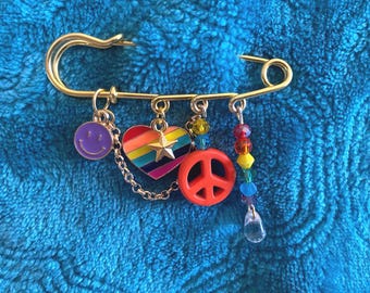 PRIDE Safety Pin/Broach with Rainbow Heart and Crystal Beads, Peace and Happy Face Charms.