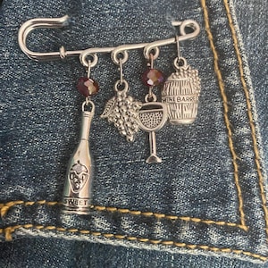 Wine Lover’s Silver Safety Pin/Broach with Grapes, Wine Bottle, Wine Barrel and Wine Glass Charms, plus Beautiful Glass Beads.