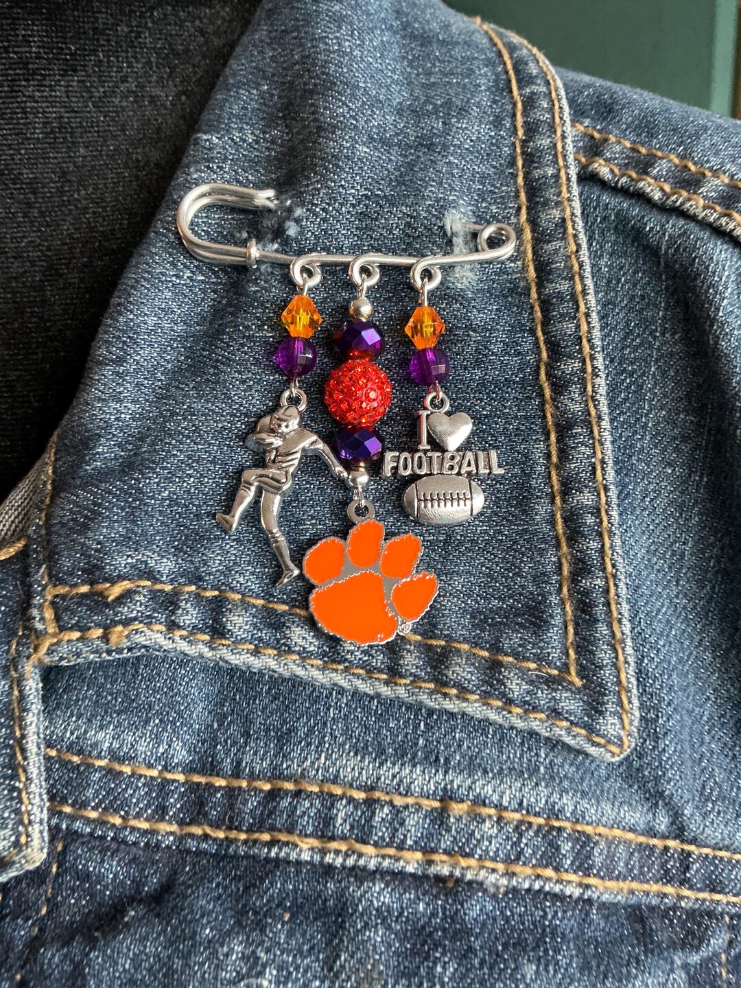 Clemson University Silver Safety Pin. There is an Clemson Tiger Paw, a ...