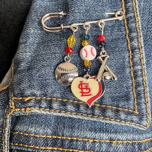 St. Louis Cardinals Silver Safety Pin with Cardinals Logo, Silver Baseball and Bats and Ball Charms, plus Beads in Team Colors.