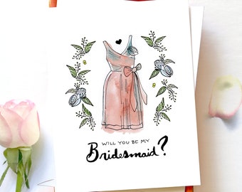 Puede incluir: Una tarjeta blanca con una ilustración de acuarela de un vestido de dama de honor rosa con un lazo. La tarjeta tiene el texto "Will you be my Bridesmaid?" escrito en negro.