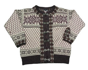 May include: A cream-colored cardigan with a geometric pattern in shades of brown and purple. The sweater features a diamond pattern, snowflake designs, and metal clasps down the front. The cuffs and hem are dark brown.