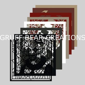 May include: A stack of laser-cut art pieces in various colors, including black, white, and shades of brown and red. The front piece features a detailed, abstract design with the text "GRUFF BEAR CREATIONS".