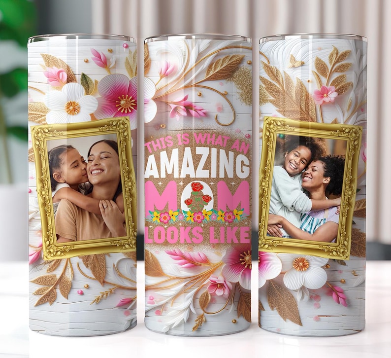 May include: A white tumbler with a floral design and gold accents. The tumbler features a photo of a mother and daughter with the text "This is what an amazing mom looks like".