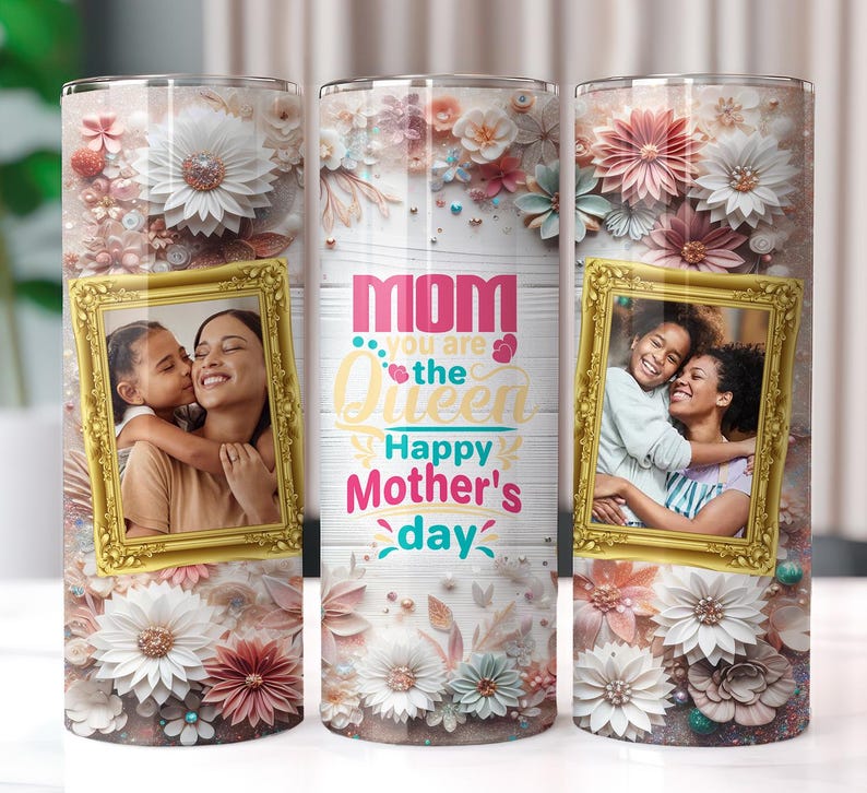 May include: A white tumbler with a floral design and the text "Mom you are the Queen Happy Mother's Day". The tumbler features a photo of a mother and daughter in a gold frame.