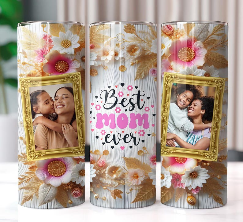 May include: Three stainless steel tumblers with white and gold floral designs. Each tumbler features a photo of two people in a gold frame. The text "Best Mom Ever" is printed in pink and black on the middle tumbler.