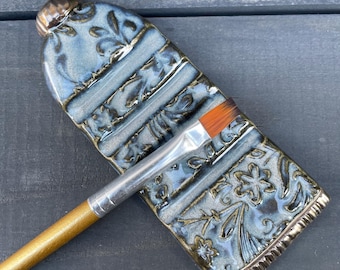 Unique Handmade Ceramic Brush Rest – Artist Paint Tube with Textured Flower Accents, Pottery Gift for Artist