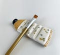 Handmade Ceramic Brush Rest: Artist Paint Tube with Tiny Flowers