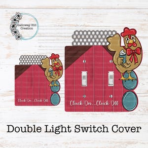May include: Decorative double light switch cover featuring a cartoon chicken with a red bow and a drink. The cover has a red barn design with the text "Cluck On... Cluck Off".