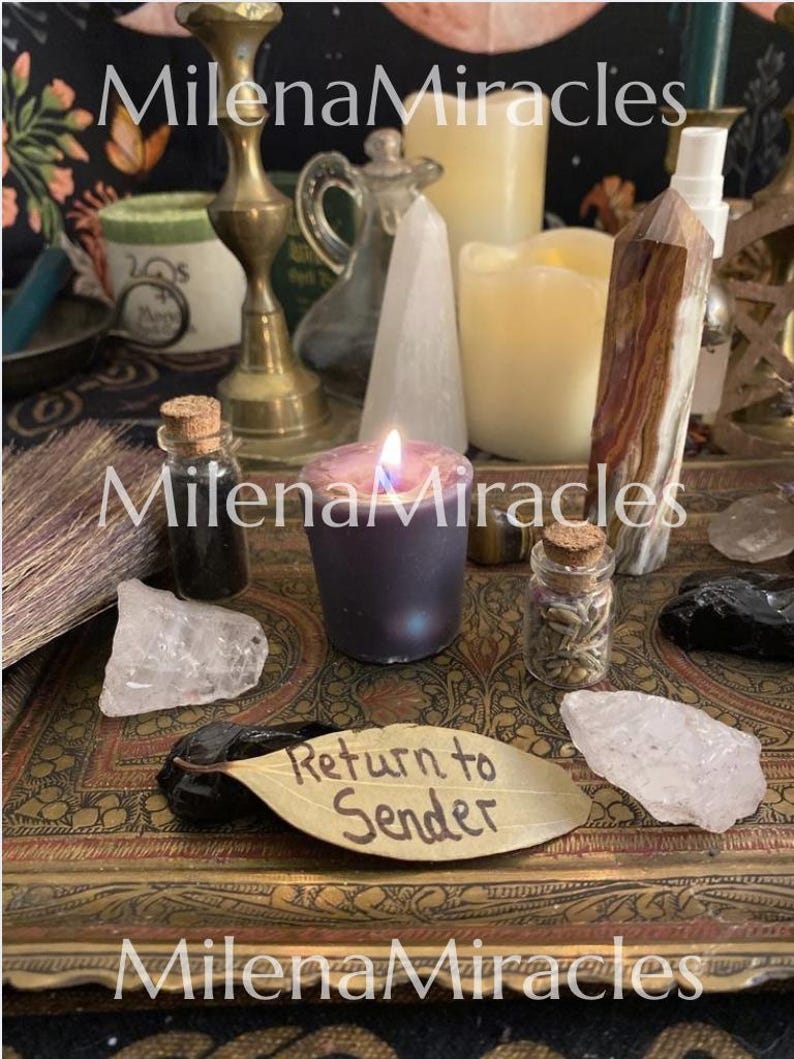 May include: A collection of ritual items on a decorative tray, including a lit purple candle, a brown and white crystal point, clear quartz, black stones, a small broom, glass vials with cork stoppers, and a leaf inscribed with Return to Sender.