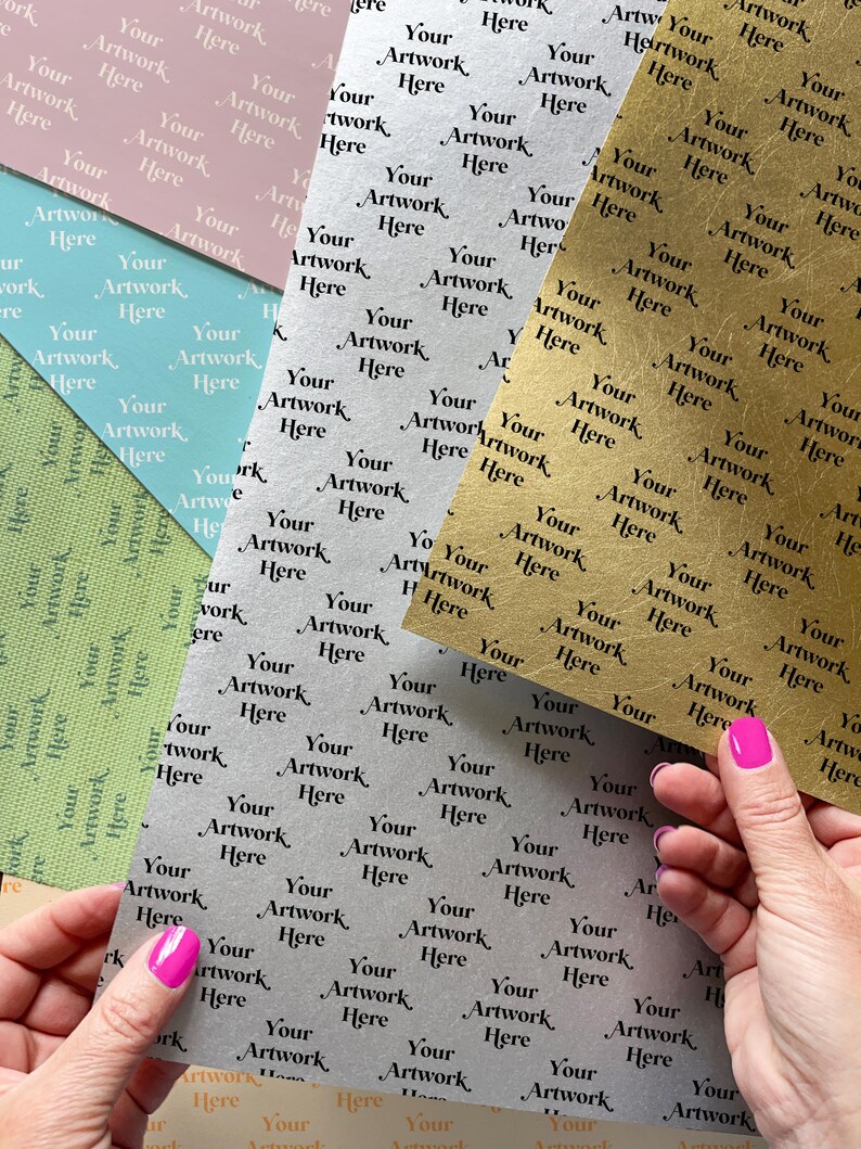 May include: A collection of patterned paper sheets in various colors, including pink, blue, green, silver, and gold. Each sheet features a repeating pattern of the text "Your Artwork Here".